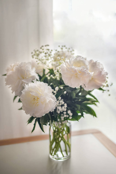 White peonies flowers with Gypsophila in vase on white background - Fotoğraf, Görsel