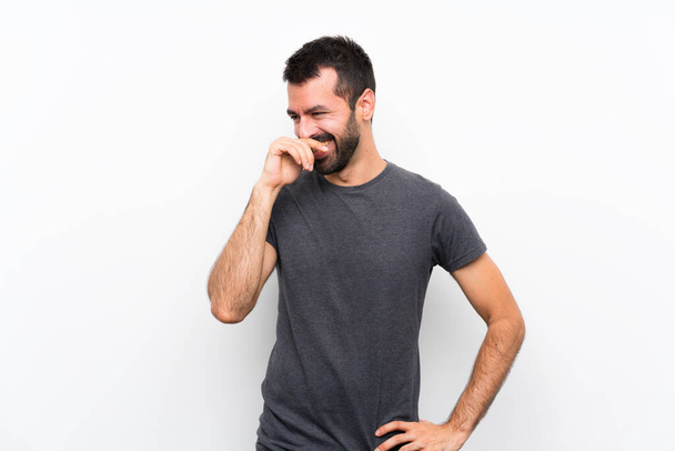 Young handsome man over isolated white background smiling a lot - Φωτογραφία, εικόνα