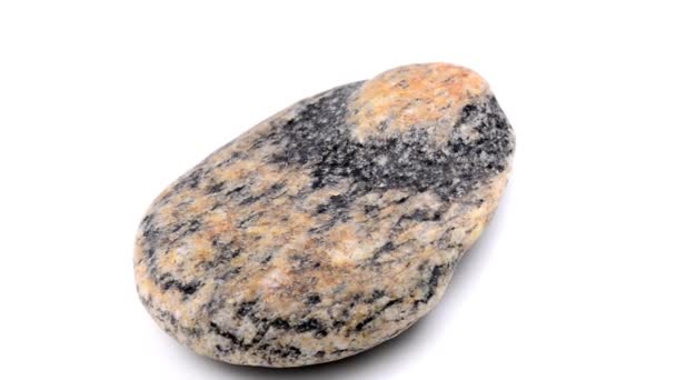 Gneiss with red feldspar eyes on a turn table - Footage, Video