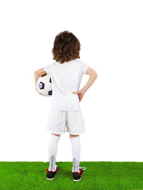 back view of soccer player in white uniform standing on grass isolated on white background - Foto, Imagem
