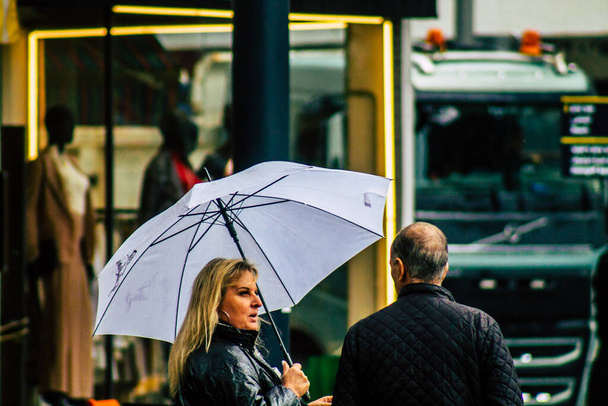 Tel Aviv Israel February 19, 2020 View of unidentified people walking in the streets of Tel Aviv during a raining day in winter - Foto, Imagen