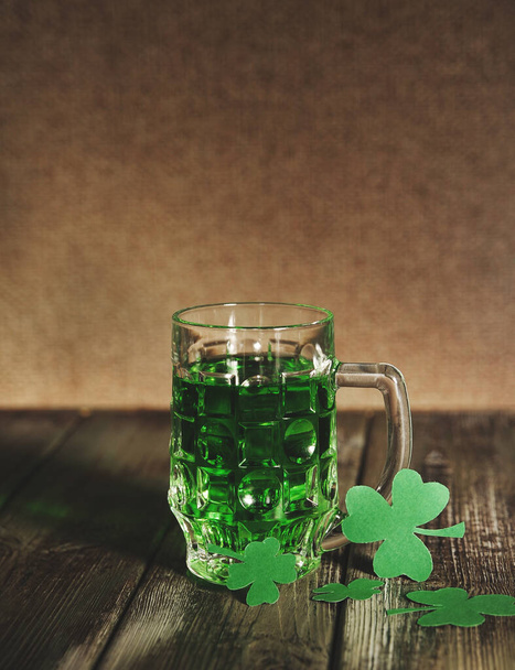 Green beer on wooden background with bokeh. Patrick's day background. - Фото, зображення