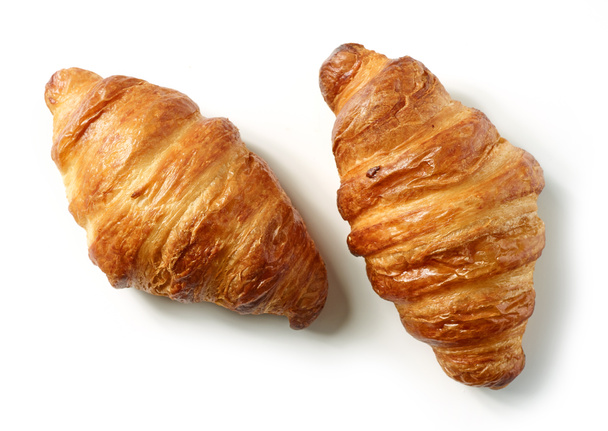 croissants recém-assados isolados no fundo branco, vista superior
 - Foto, Imagem