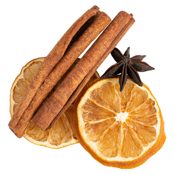 Cinnamon sticks, slices of dried lemon, star anise isolated on white background. - Photo, Image