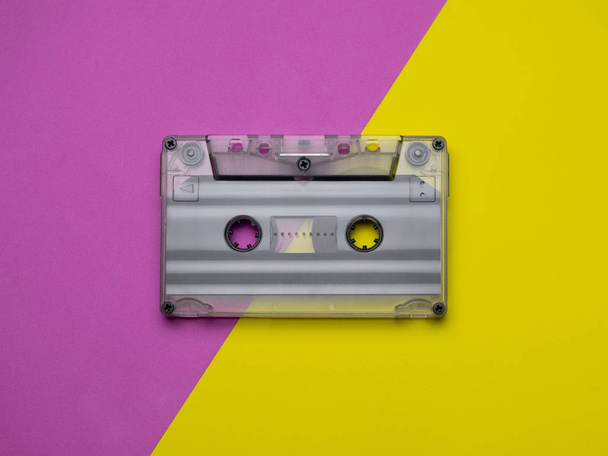 Retro cassettes on a yellow and pink background. view from above. copy space. - Valokuva, kuva