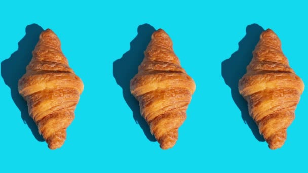 flat lay of croissants motion pattern on a color background - Footage, Video