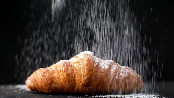 freshly baked croissants with powdered sugar, slow motion - Footage, Video