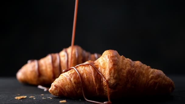 freshly baked croissants with chocolate sauce, slow motion - Footage, Video