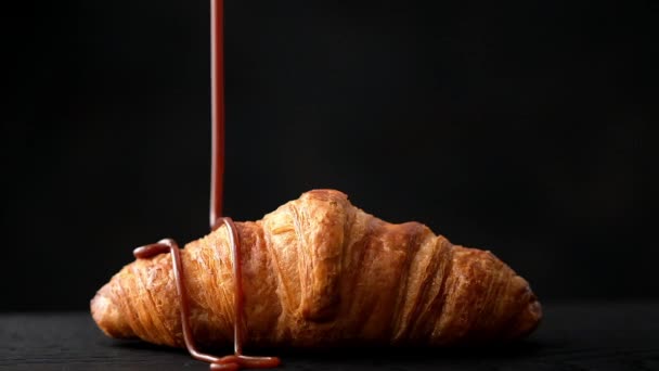 freshly baked croissant with chocolate sauce, slow motion - Footage, Video
