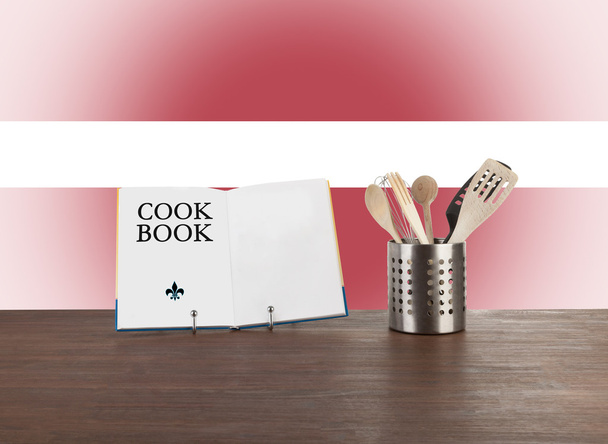 Cookbook and kitchen utensils with Latvian flag - Photo, Image