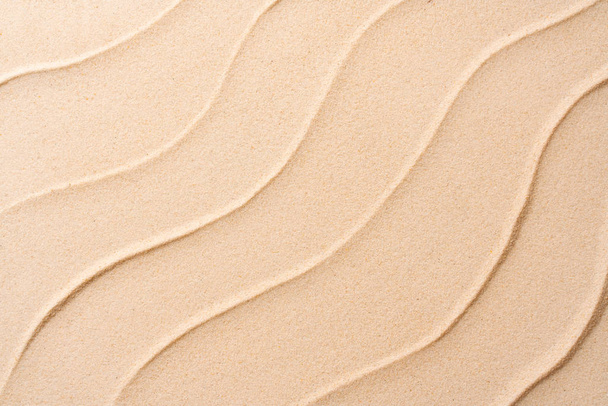 Flat lay top view copy space, Minimal exotic concept. Creative layout of sand waves. summer beach sand background, vacation and travel concept. - Photo, image