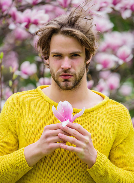You are so beautiful. spring holiday. Mothers day gift. sakura smell. enjoy good weather. allergy. sexy guy blooming magnolia flower tree. man natural seasonal background. feel refreshed. Womens day - Foto, Imagem
