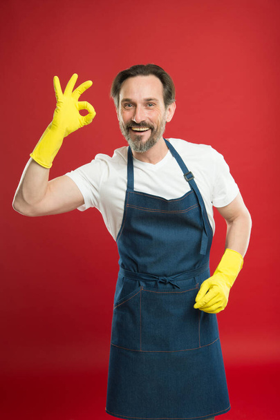 Keeping your home clean. Happy cleaner in yellow gloves show ok sign. Household work. Housekeeping routine. Cleaning service. Sanitation. Clean up. House clean. Things look better when theyre clean - Valokuva, kuva