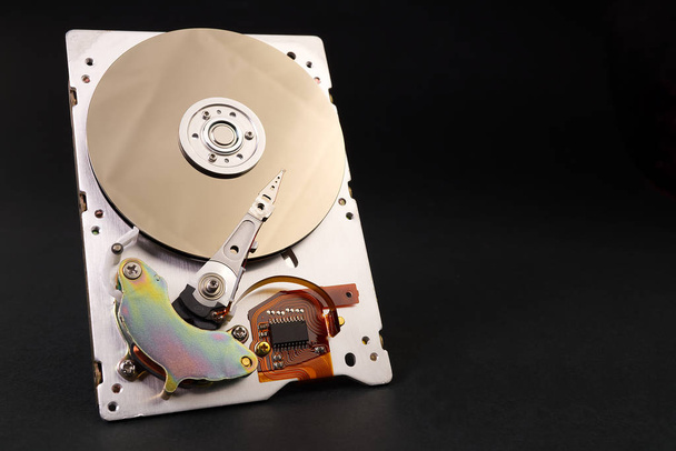 A hard disk drive HDD, hard disk, hard drive, or fixed disk is an electro-mechanical data storage device that uses magnetic storage to store and retrieve digital data using one or more rigid rapidly - Photo, Image