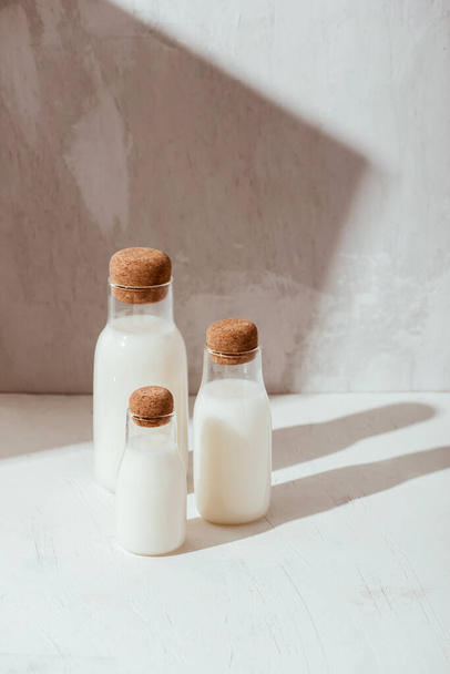 Milk or cocktail creative concept, minimalism styled, angle view, space for a text. - Фото, изображение