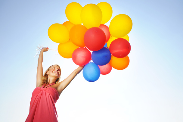 Nainen ilmapallojen kanssa
 - Valokuva, kuva