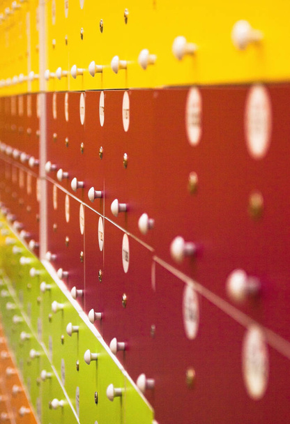 Lockers in the locker room. Bright yellow and red doors.  - Photo, Image