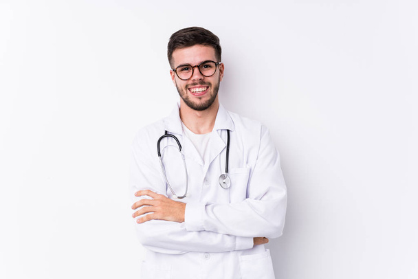 Young caucasian doctor man isolated laughing and having fun. - Photo, Image