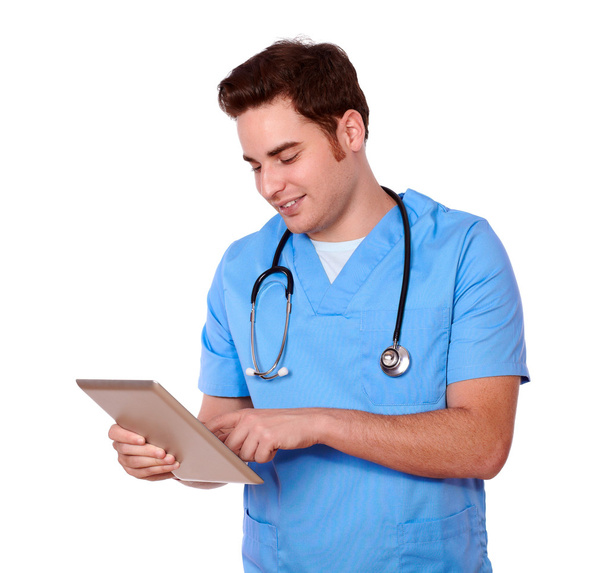 Medical nurse guy using his tablet pc - Фото, зображення