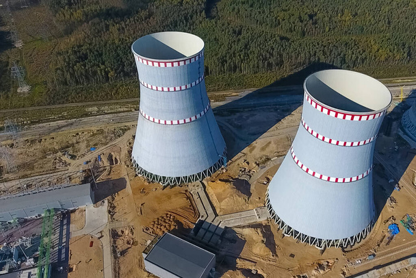 Aerial survey of a nuclear power plant under construction. Installation and construction of a power plant. Nuclear power. - Photo, Image
