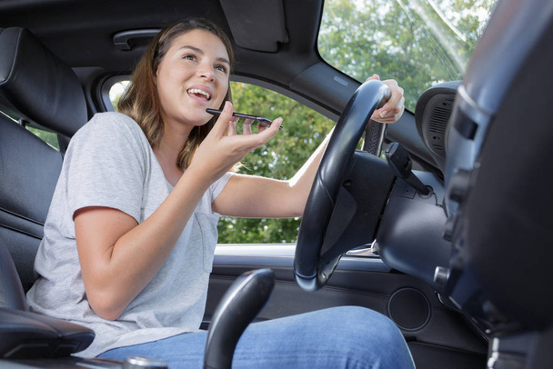 woman driving car and talking on phone - Фото, зображення