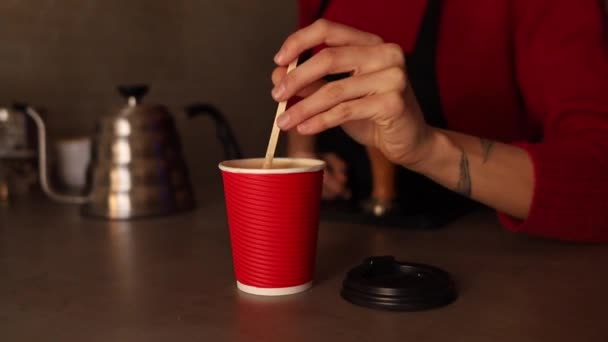 barista with a cap of takeaway coffee - Footage, Video