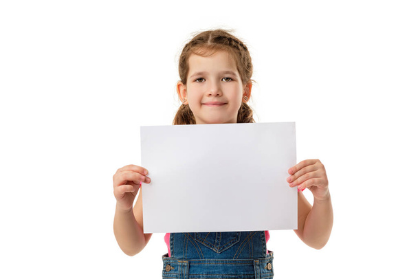 Happy cute child girl holding empty blank - Fotografie, Obrázek
