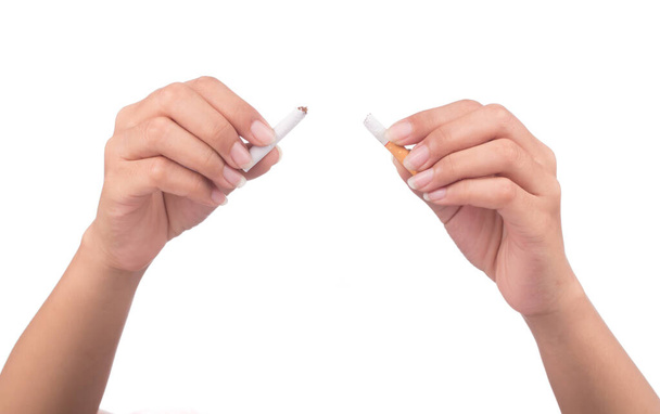 Quit smoking, human hands breaking the cigarette isolated on white background. - Foto, Imagen