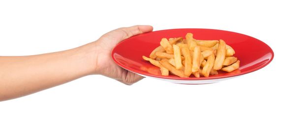 mano sosteniendo papas fritas en un plato aislado sobre un fondo blanco
 - Foto, imagen