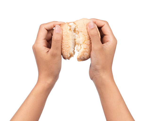 hand holding Vanilla cream biscuits isolated on white background. - 写真・画像
