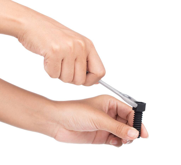 Arbeiter Hand Festziehen oder Lösen einer Schraubenmutter mit einem Schraubenschlüssel auf weißem Hintergrund - Foto, Bild