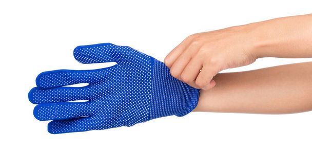 Hand trägt einen blauen Handschuh auf weißem Hintergrund - Foto, Bild