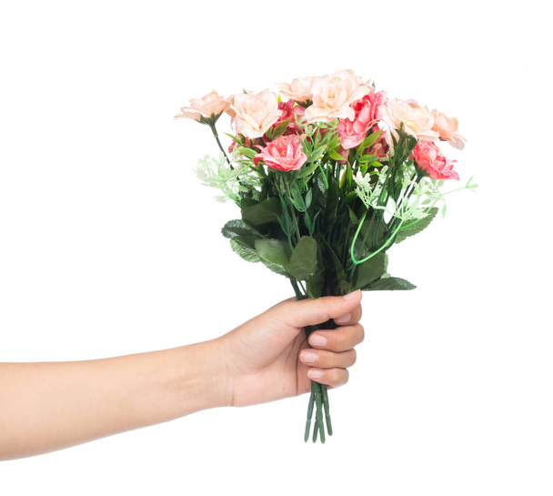 Hand holding bunch of flowers isolated on white background - Foto, Imagen