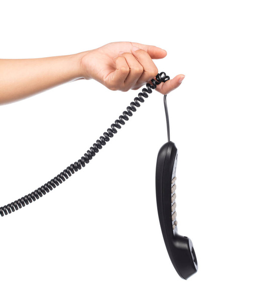 hand holding black telephone isolated on white background - Photo, Image
