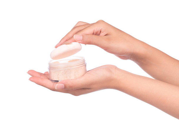 Hand holding a face powder sponge Isolation on white background.  - Photo, Image