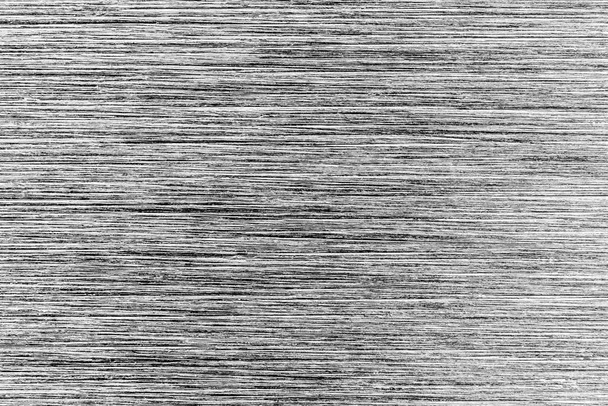 Textura metálica monocromática gris con arañazos blancos. Superposición de fondo negro de ruido abstracto para el diseño. Arte estilizado baner
. - Foto, Imagen