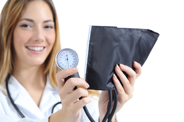 Female doctor holding and showing a sphygmomanometer - Photo, image