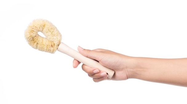 hand holding Wooden toilet brush isolated on white background - Фото, изображение