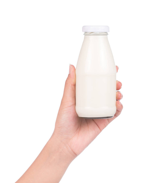 hand holding Bottle of milk isolated on white background - 写真・画像