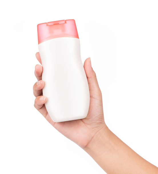 Hand holding bottle lotion isolated on white background - Photo, Image