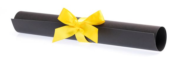 roll fekete papír sárga szalaggal elszigetelt fehér háttér - Fotó, kép