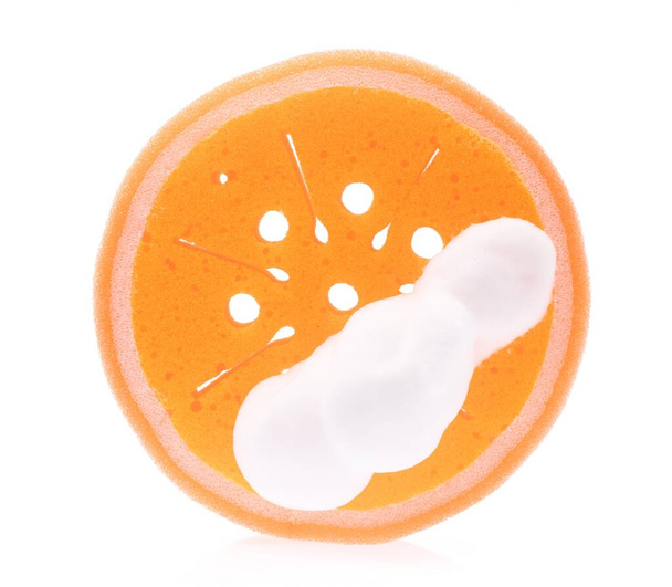 Orange sponge wet with foam isolated on white background. - Photo, Image