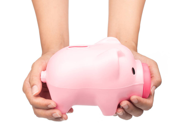 χέρι κρατώντας Piggy τράπεζα στυλ κουτί χρήματα απομονώνονται σε λευκό φόντο - Φωτογραφία, εικόνα