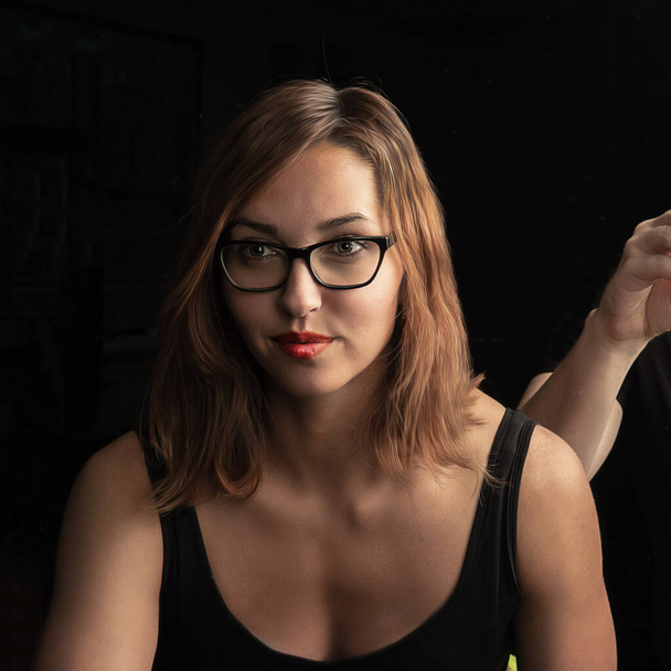 The girl looks at the camera, portrait photography, on black background glasses - 写真・画像