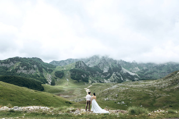 Couple on a background of mountains - Photo, Image
