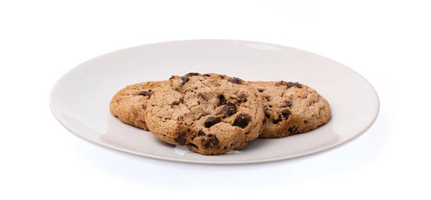 Beyaz arka planda izole edilmiş yemek üzerine çikolatalı bisküviler - Fotoğraf, Görsel