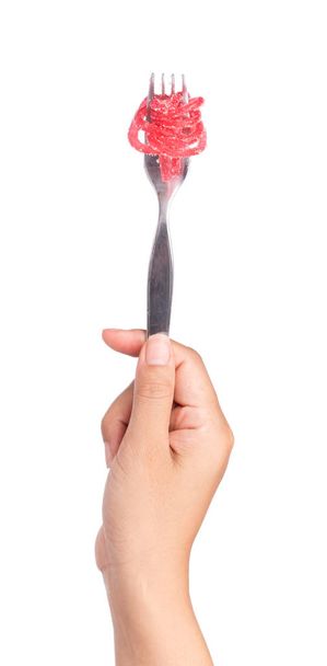 mano tenedor jalea dulce, postre colorido con azúcar en el plato aislado sobre fondo blanco
. - Foto, imagen