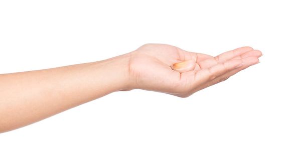χέρι που κρατά το σκόρδο απομονωμένο σε λευκό φόντο - Φωτογραφία, εικόνα