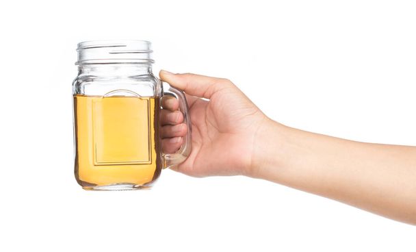 hand holding jug of alcohol isolated on white background - Foto, imagen