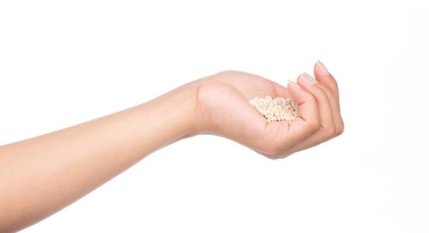hand holding Barley rice isolated on white background - Fotó, kép
